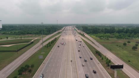 establishing aerial shot of cars on 59 south in sugarland, texas just outside of houston