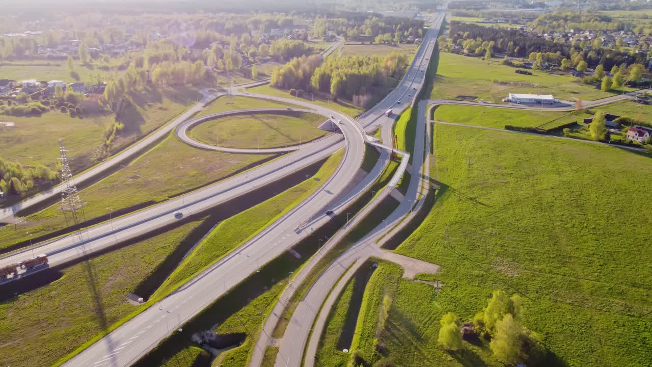 Aerial view of Katlakalns intersection and highway system surrounded by green nature