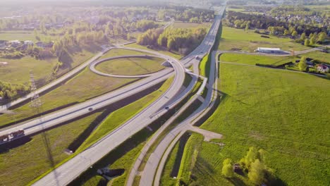 aerial view of katlakalns intersection and highway system surrounded by green nature