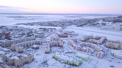 aerial view of a snowy city in the arctic circle