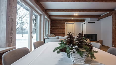 smooth panning shot of a livingroom in a house with panorama windows and a view to the snow