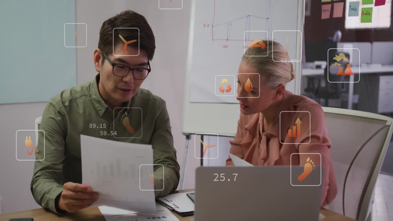 Analyzing documents with animation overlays, business professionals working in office