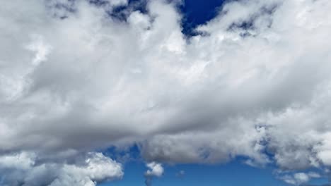 fast moving cloud timelapse against bright blue sky