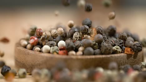 Mixed-peppercorns-in-a-super-slow-motion.-Dry-mix-peppercorns-close-up.