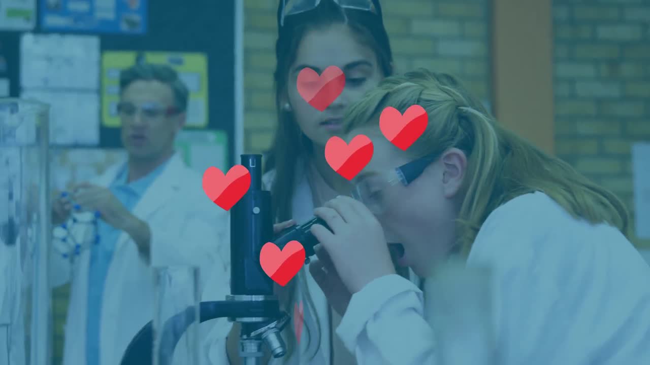 animación de corazones que caen sobre un grupo diverso de estudiantes en el laboratorio