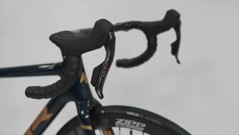 close-up of road bike handlebars and sram red controls