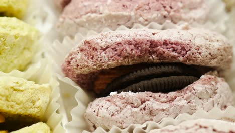 close up of macaroons with orange and chocolate,