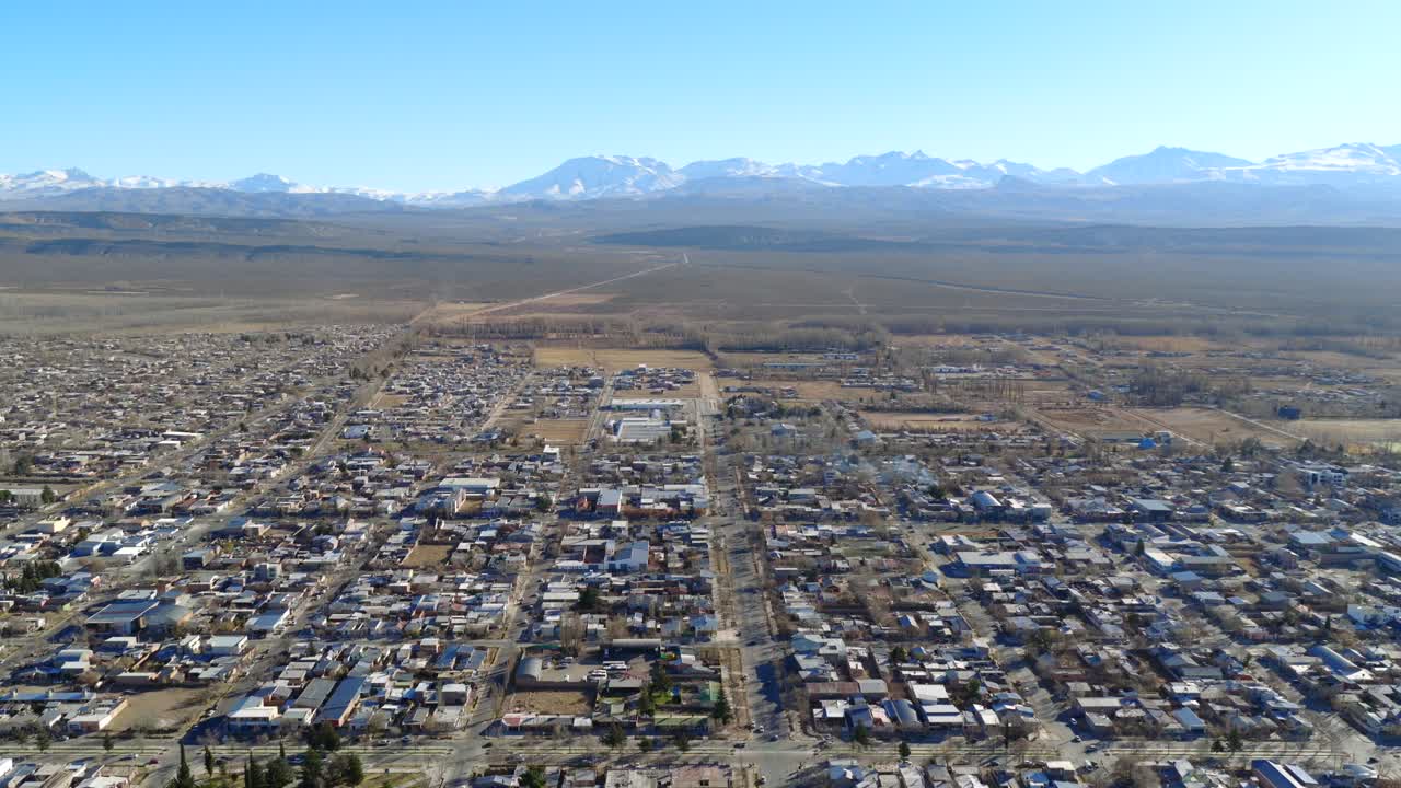 Aerial view of Malargüe city with the Andes mountains in the distance.