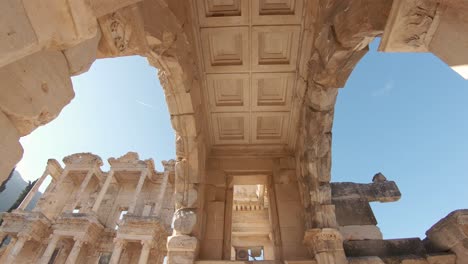 elaborated carved marble details and architecture features, celsus library, ephesus, turkey, tilt down shot