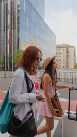 two women walking on a city street