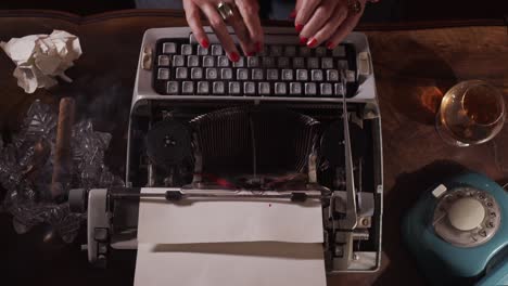 lady hands writing on old fashioned typewriter, smoking cigar, drinking whisky