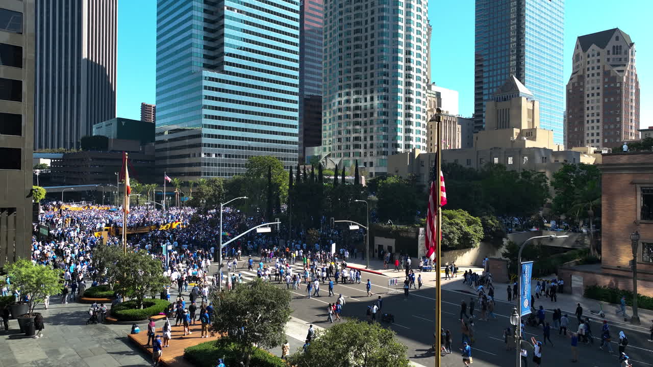 Drone rising in front of a crowd celebrating the Dodgers World Series win in LA