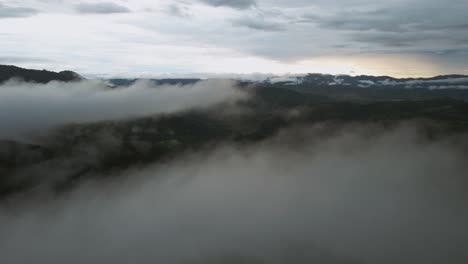 drone flight over the mist in the sunset time, costa rica