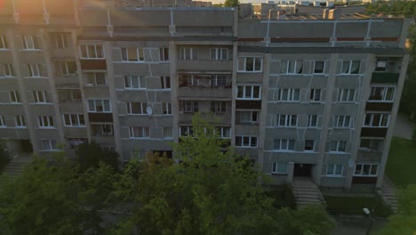 reveal of former ussr city from close up window prefebricated soviet apartment building