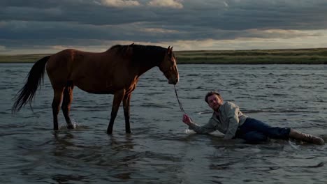 cowboy and horse in the river