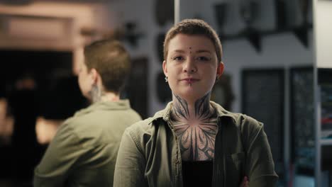 portrait of young adult owner of tattoo salon.