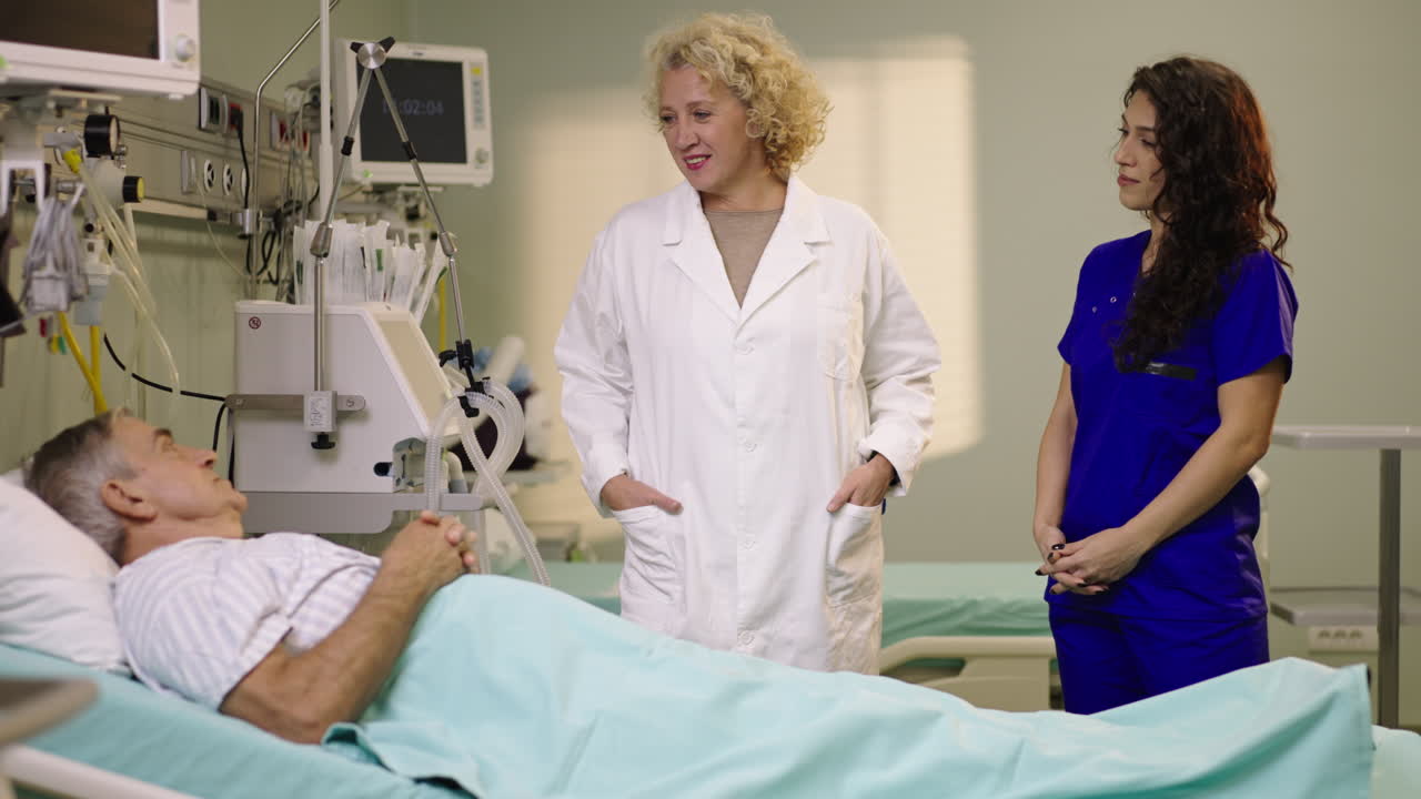 Doctor and Nurse Attending to Patient in Hospital Bed
