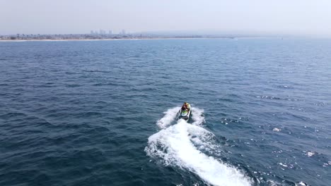 An-Excellent-Aerial-Shot-Of-A-Couple-Jet-Skiing-Far-From-The-Coast