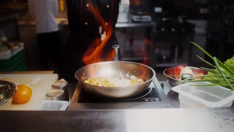 chef cooking vegetables in a pan