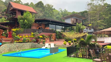 Rustic hilltop resort with private blue pool, tropical garden, and scenic architecture—ideal for travel, wellness, and eco-tourism