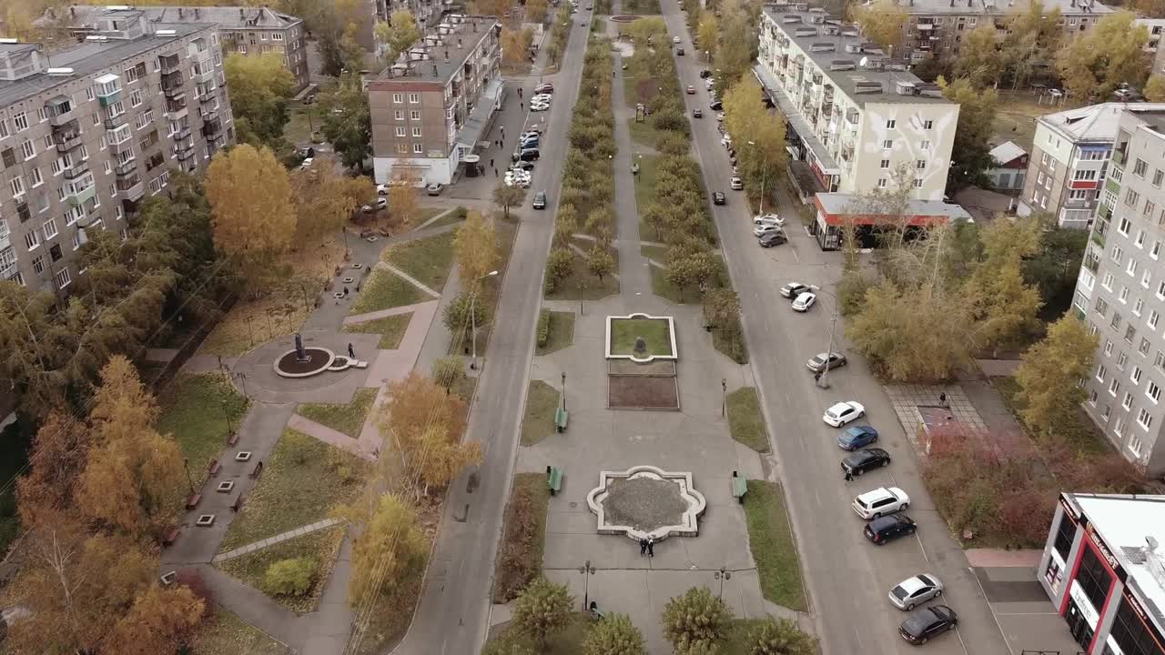 Aerial dolly in downtown industrial city of Bratsk in Russia in Autumn