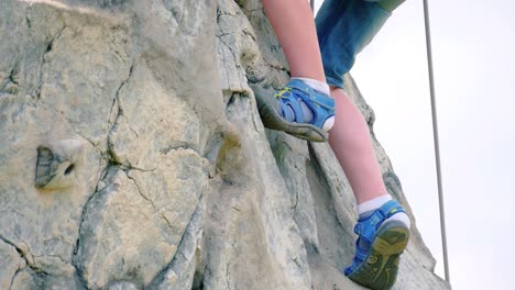 strong and healthy legs climbing the rocky mountain