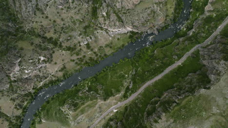 river stream of kura flowing in deep gorges of tmogvi fortress in southern georgia