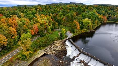 scenic view on the stunning park with a lake, dam and waterfalls. aerial perspective on the beautiful nature in autumn.