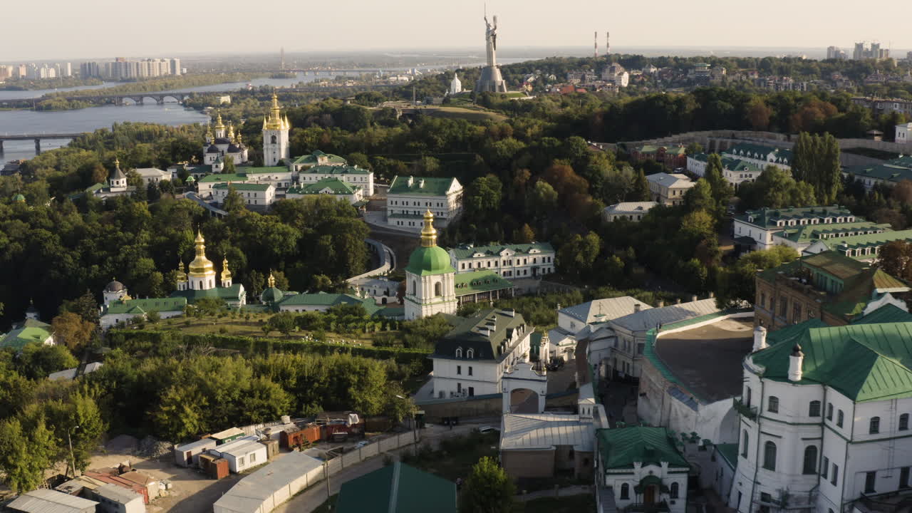 Aerial view on Kyiv city, Dnipro River, Motherland Monument, and Kyiv Pechersk Lavra In Kiev, Ukraine - drone shot