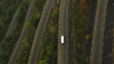 Drone-shot-of-White-Cargo-Van-Transportation-on-BP-Highway-road-of-Nepal