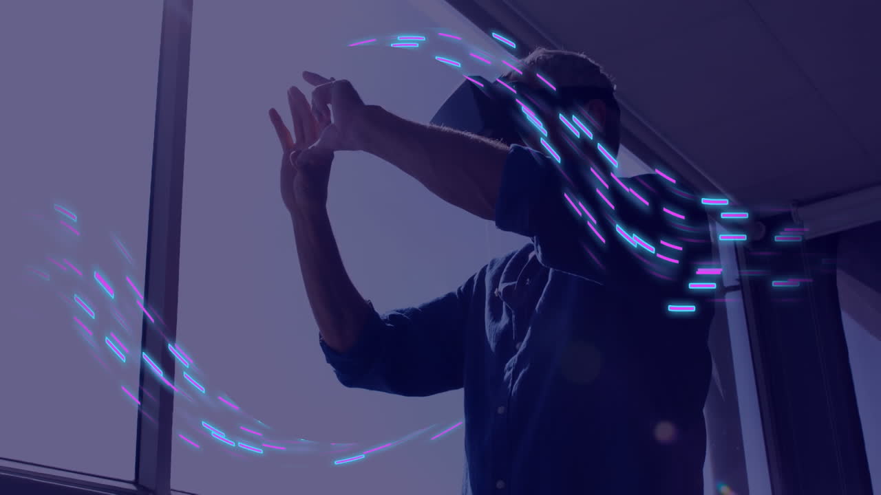 Animation of glowing light trails of data transfer over caucasian man in vr headset