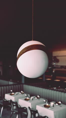 modern restaurant interior with a round egg-shaped pendant light