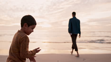 Throwing-sand,-playful-and-a-child-at-the-beach