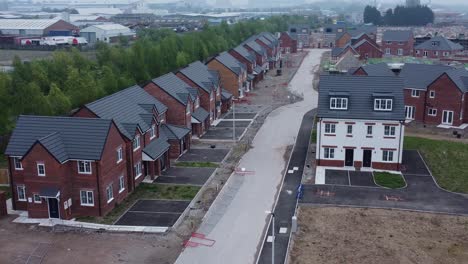 new subdivision incomplete neighbourhood housing construction site grounds aerial view