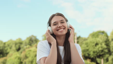 woman listening to music in earphones