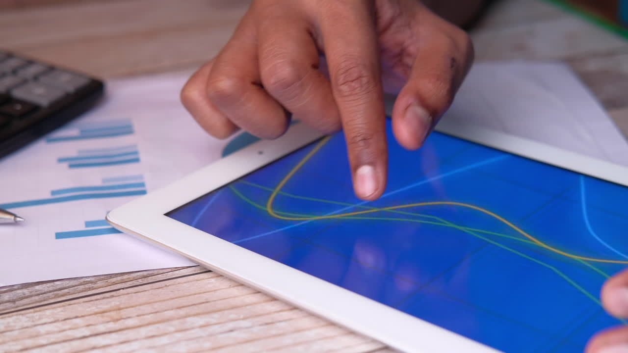 Person reviewing data on a tablet
