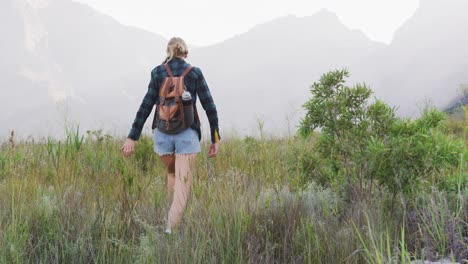 caucasian woman hiking in nature