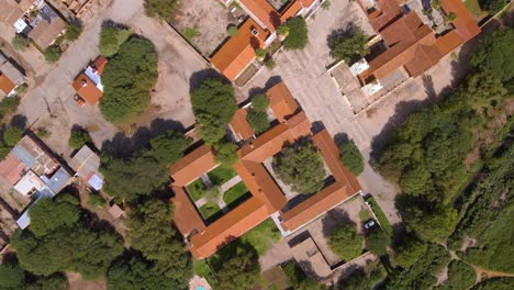 top down drone shot flying over the small town of molinos in salta, argentina