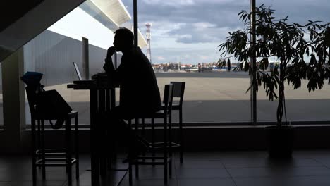 businessman working at airport cafe