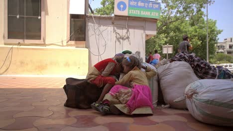 young indian children sat on floor