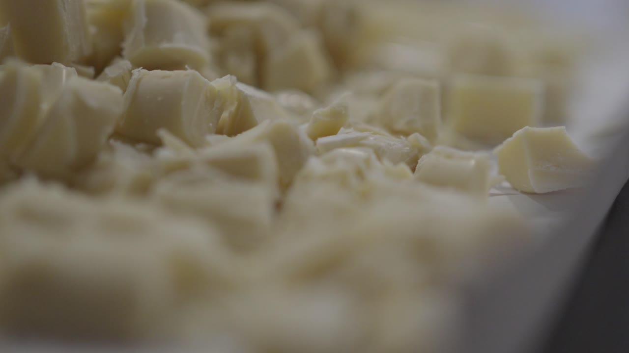 Close up slide shot of white chocolate chunks