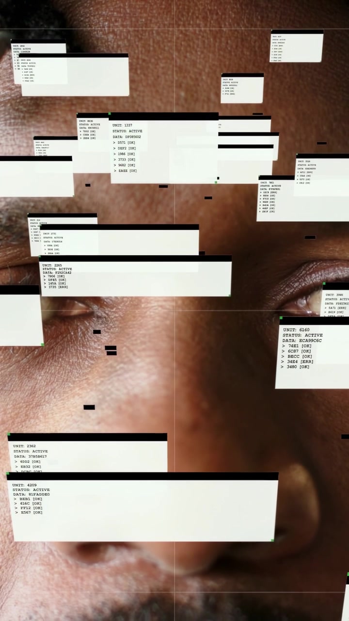 Vertical video: Mature man closing eyes, system update spawning dialog boxes across face for tech