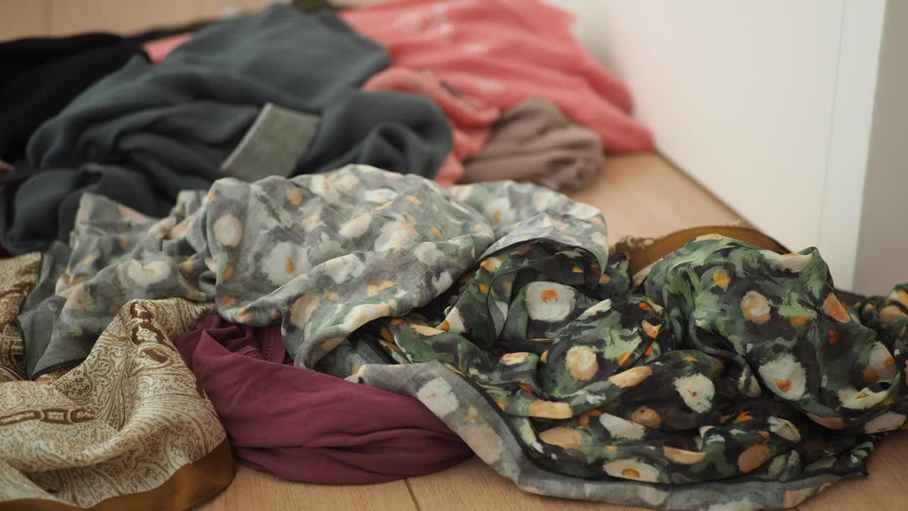 Pile of Clothes/Scarves on Floor
