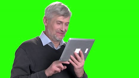 happy caucasian man using computer tablet.