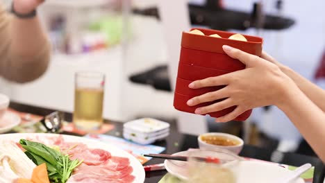 friends enjoying a hotpot meal together