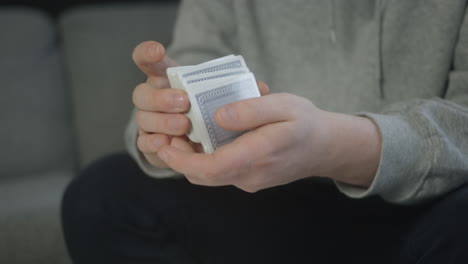 Male-hands-shuffle-a-deck-of-cards-for-a-poker-game-slow-motion