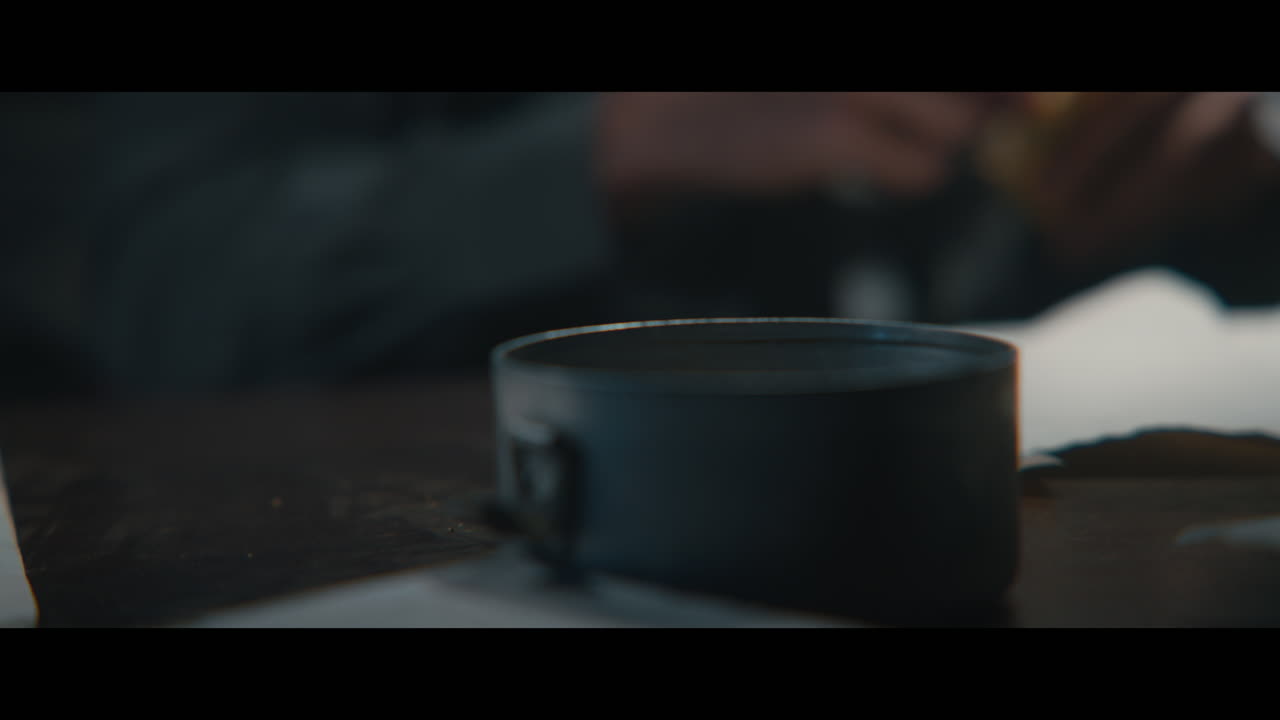 An intelligence officer takes ligter and cigarettes