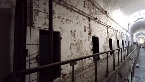 slow 180° pan across cellblock at eastern state penitentiary