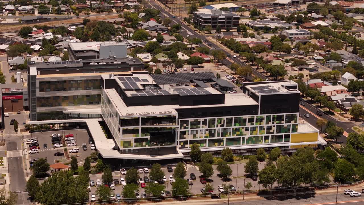 Wagga Wagga Base Hospital complex anchors healthcare services within the regional cityscape, aerial medium establish