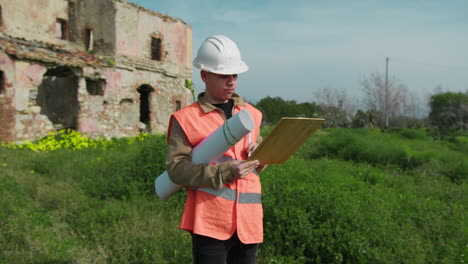 architect outdoor writing and drawing notes about a project